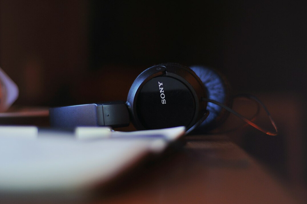 Broadcast production desk with headset and notebook
